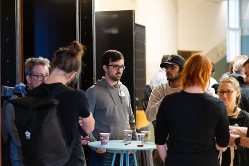 A group of people enjoying a coffee during a break