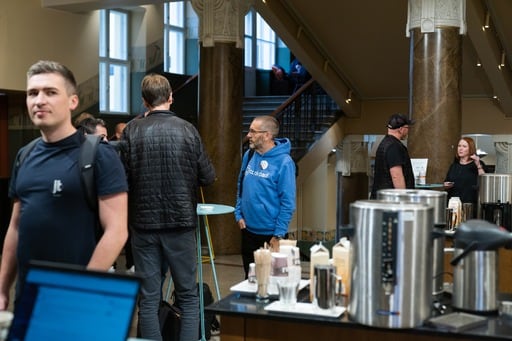 Some more attendees in the foyer