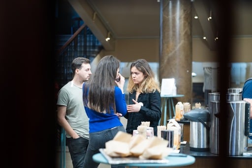 A group of two women and a man having a discussion