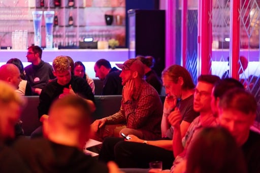 Big group of people having a discussion at the party