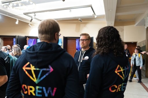 Crew members in the foyer
