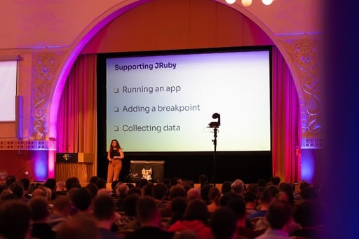 Yarden Laifenfeld presenting her talk. ‘Supporting JRuby’ on screen.