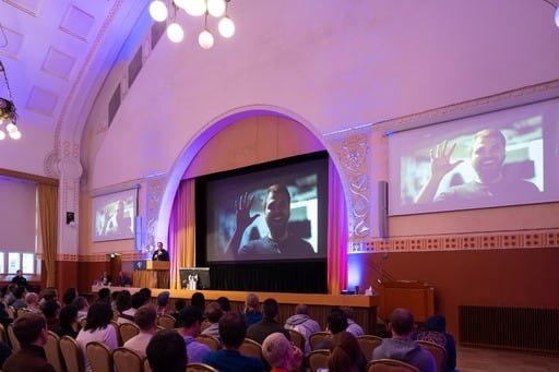 Matias Korhonen thanks Simo Virtanen for his half of the work. A photo of Simo is up on the screen.